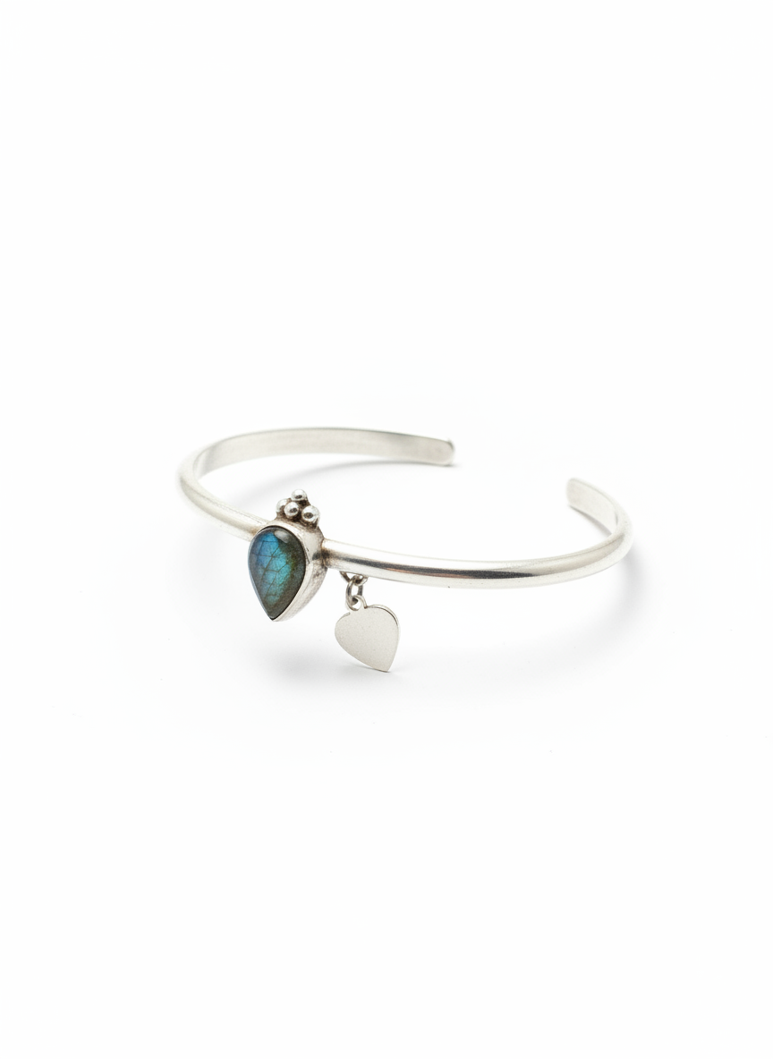 Angled view showing both crystal and heart charm