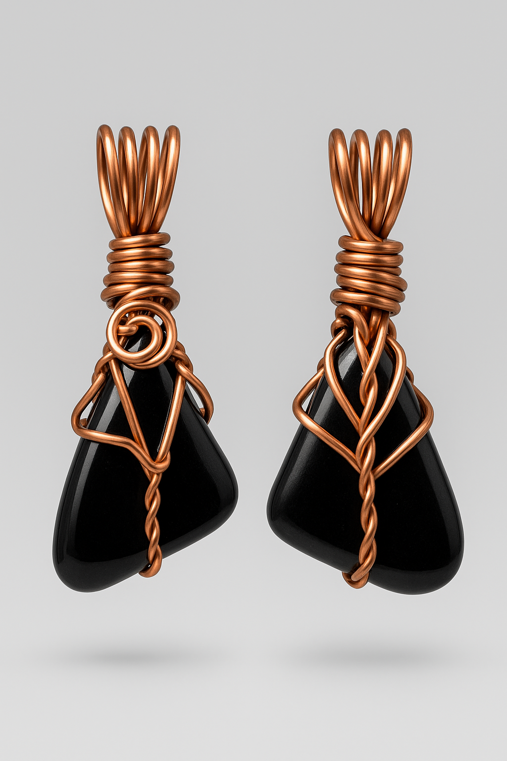 Black obsidian copper pendant front and back floating with grey background