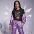 Model in iridescent purple tracksuit with crystal aesthetic