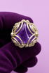 Purple velvet glove with lilac background