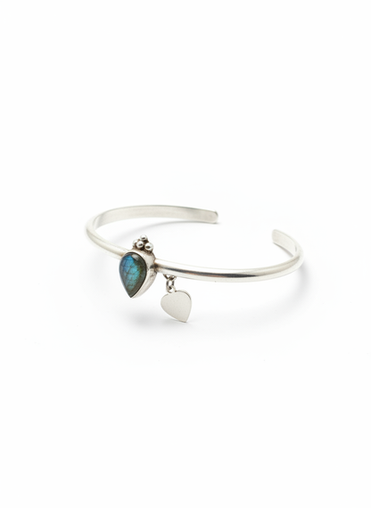 Angled view showing both crystal and heart charm