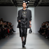 Asian descent female model in oversized blazer runway look