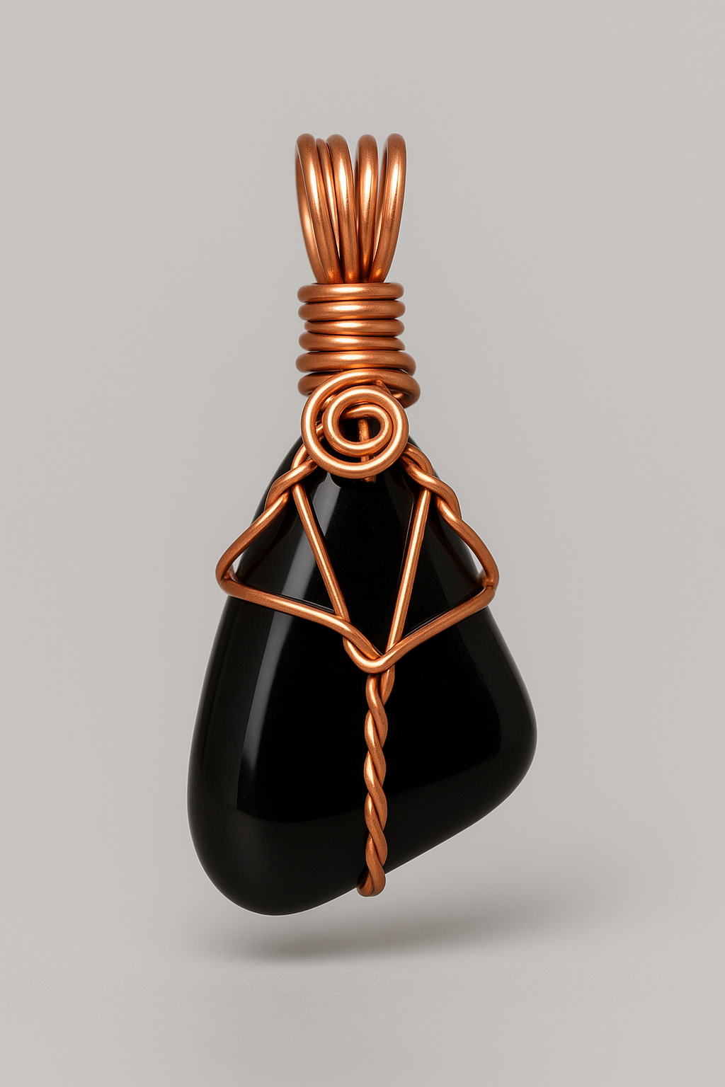 Black obsidian copper pendant front view with grey background