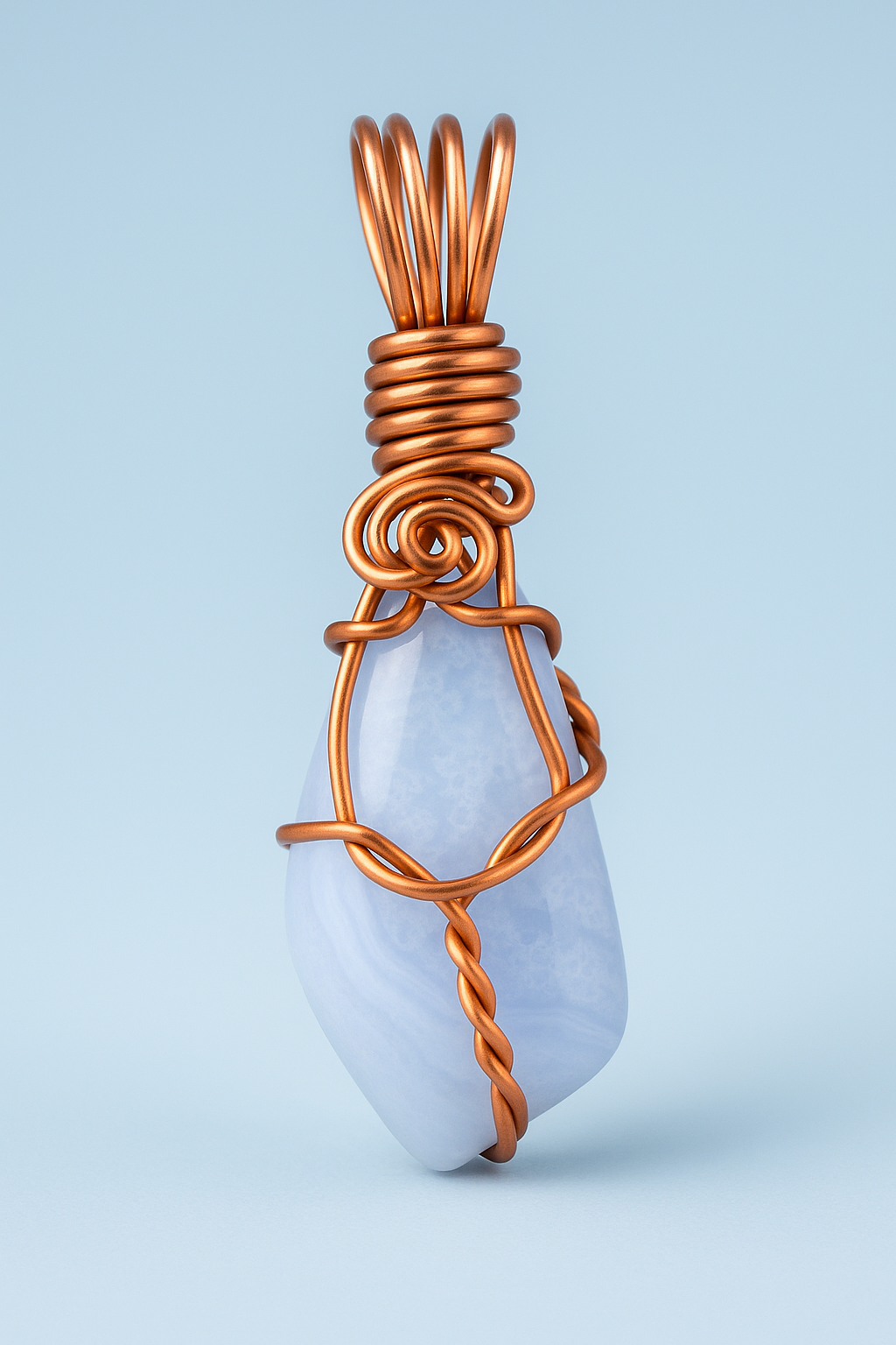 Blue lace agate copper pendant with light blue studio lighting