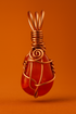 Carnelian copper pendant with orange studio background