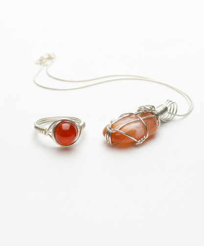 Clean studio shot of coordinated carnelian jewelry set