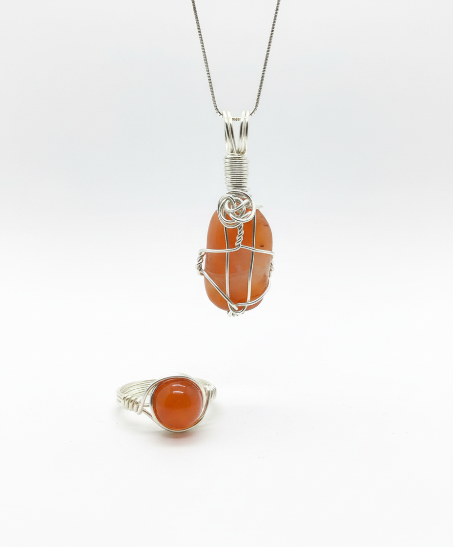 Clean white studio lighting with pendant hanging and ring on surface