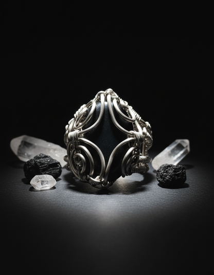 Moody dramatic lighting with clear quartz and black crystals