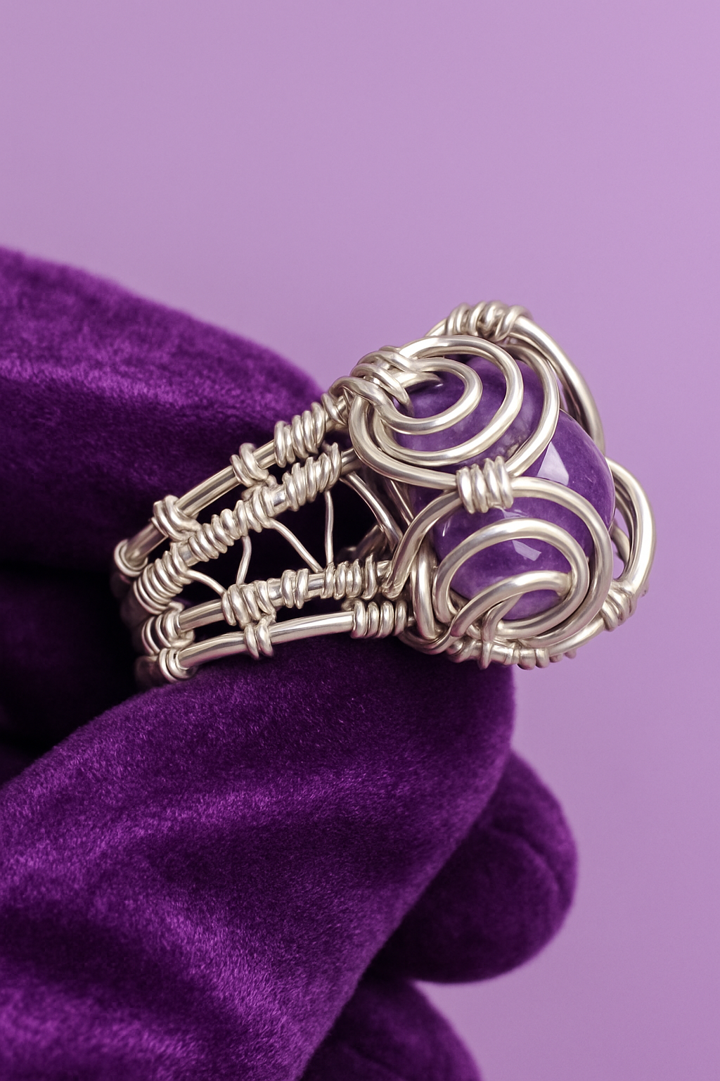 Purple velvet glove with light purple background