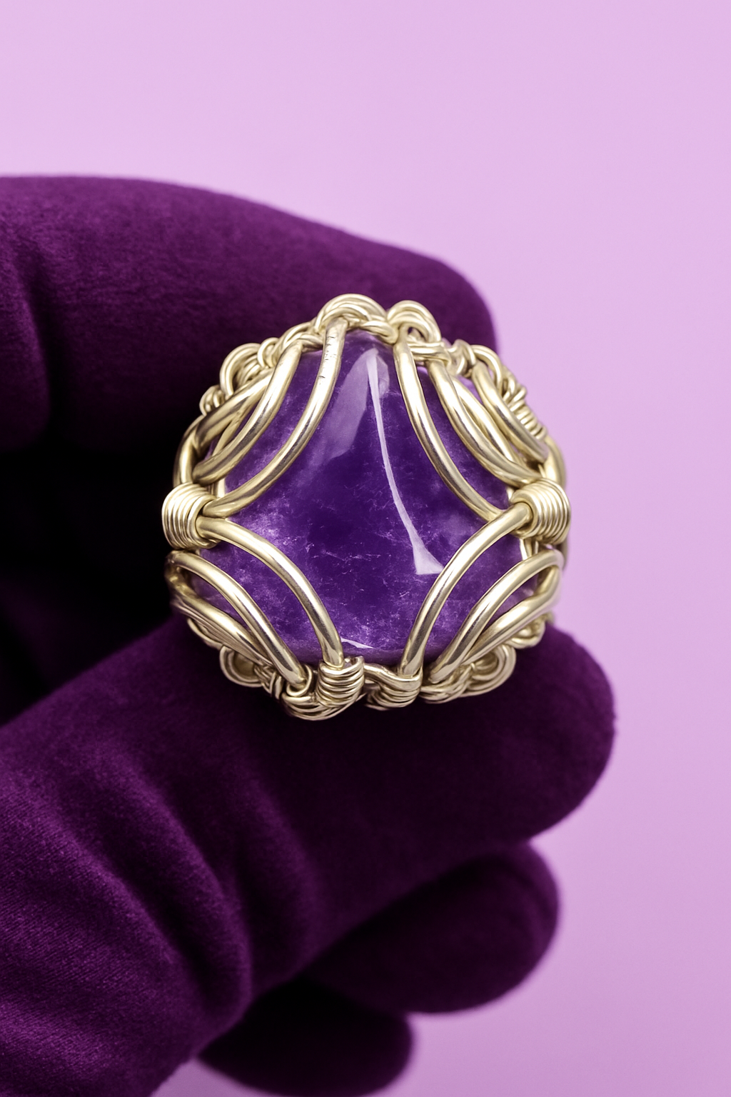 Purple velvet glove with lilac background