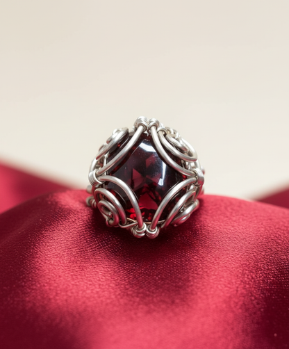 Soft deep red satin surface with cream background